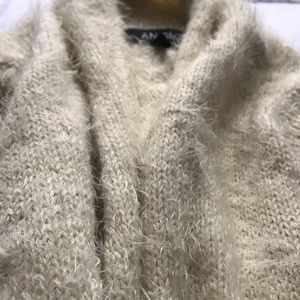 Long sleeveless sweater